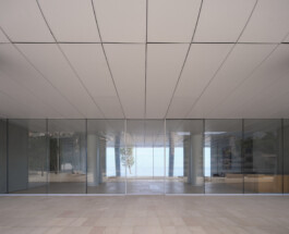 Mareterra, Renzo Piano Building Workshop, Monaco, 2024 — interior glazed facade with ceiling grid and sea view 