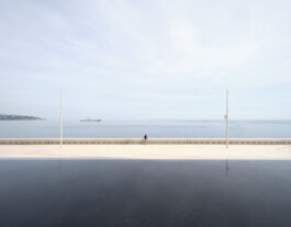 Mareterra, Renzo Piano Building Workshop, Monaco, 2024 — lone figure standing on waterfront quay with reflecting pool and Mediterranean horizon 