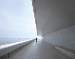 Mareterra, Renzo Piano Building Workshop, Monaco, 2024 — figure on elevated seafront promenade beneath canopy with Mediterranean horizon 